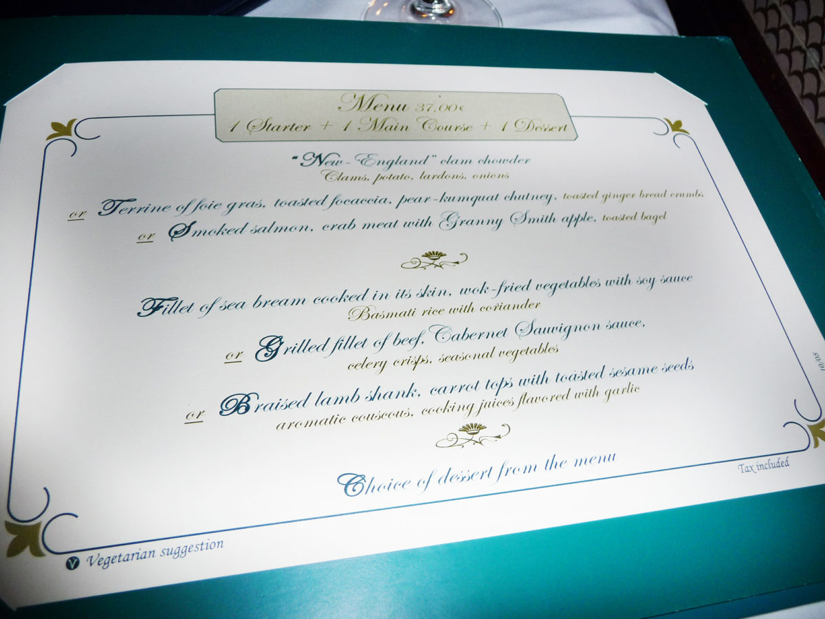 Image shows the inside of the menu at walt's restaurant in disneyland paris. The prices and items are listed.