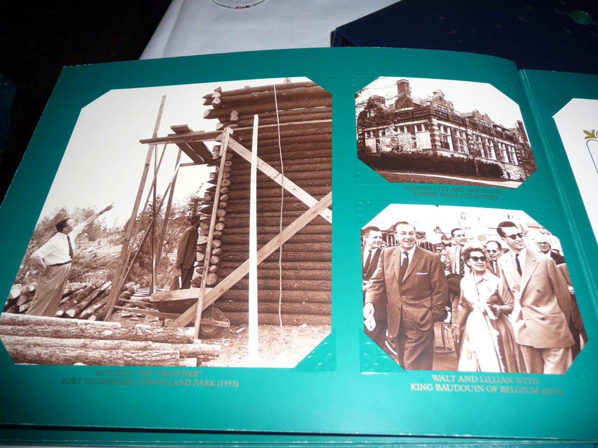 Image shows the inside of the menu at walt's restaurant in disneyland paris. There are various photographs of disney days gone by.