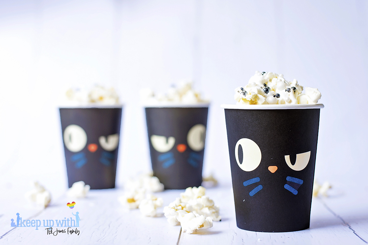Image shows three cups of Disney's hocus pocus popcorn in thackery binx paper cups. 