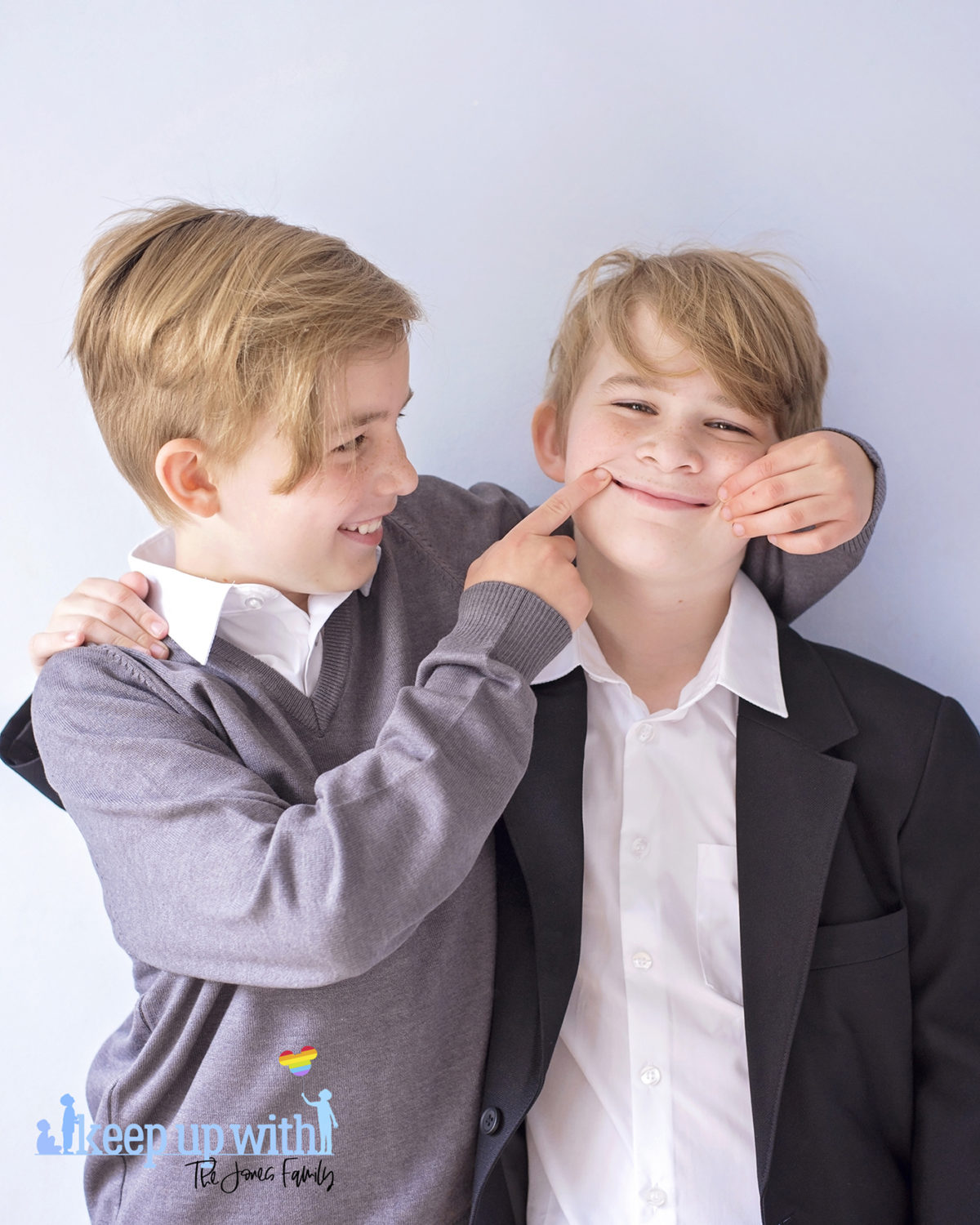 Image shows two boys wearing Trutex School Uniform. Black blazer, grey v-neck pullover and white shirt. Image by Sara-Jayne for Keep Up With The Jones Family
